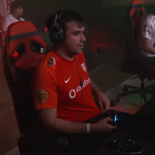 A Man Wearing A Red Shirt That Says Vodafone GIF