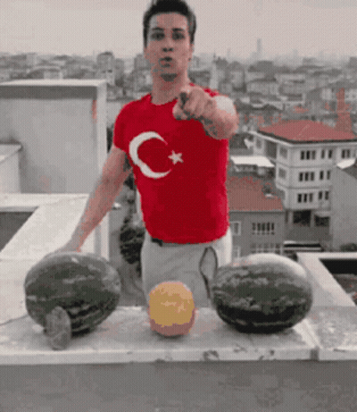 A Man Wearing A Red Shirt With A Crescent Moon And Star On It GIF