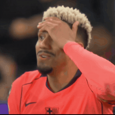 A Man Wearing A Red Shirt With A Fcb Logo On The Front GIF