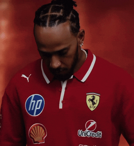 A Man Wearing A Red Shirt With An Hp Logo On The Front GIF