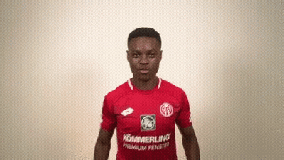 A Man Wearing A Red Shirt With Kommerling Premium Fenster On It GIF