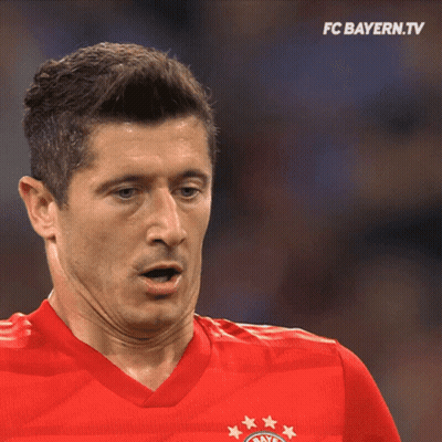 A Man Wearing A Red Shirt With The Fc Bayern Logo GIF