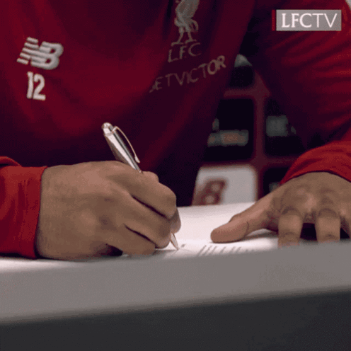 A Man Wearing A Red Shirt With The Number 12 On It GIF