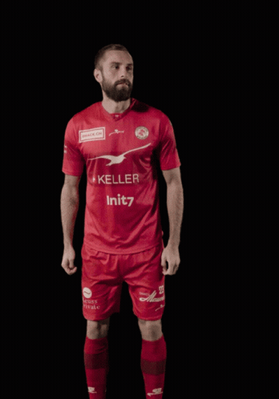 A Man Wearing A Red Shirt With The Number 23 On It GIF