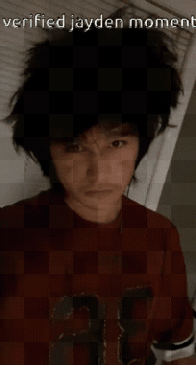 A Man Wearing A Red Shirt With The Number 3 On It GIF