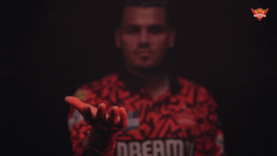 A Man Wearing A Red Shirt With The Word Dream On It GIF