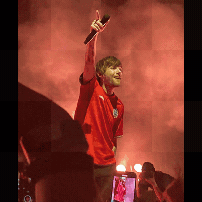 A Man Wearing A Red Shirt With The Word England On It GIF