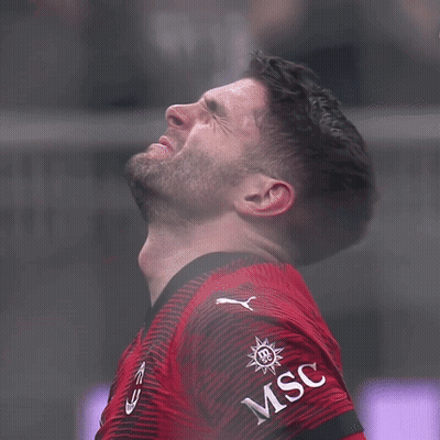 A Man Wearing A Red Shirt With The Word Msc On His Arm GIF