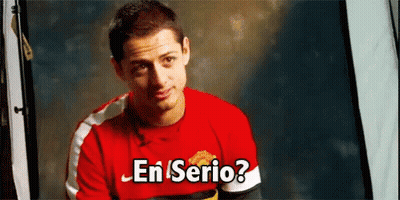 A Man Wearing A Red Shirt With The Words En Serio On It GIF