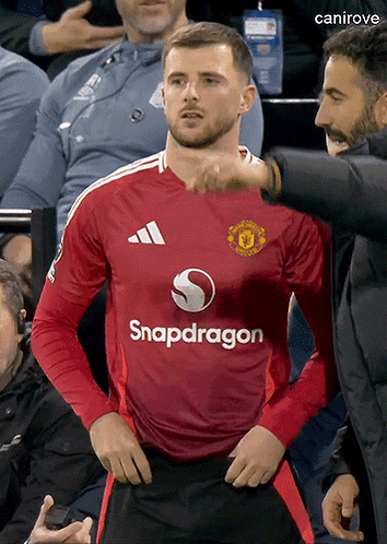 A Man Wearing A Red Snapdragon Jersey Stands In The Stands GIF
