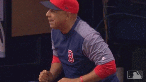 A Man Wearing A Red Sox Shirt And Hat GIF