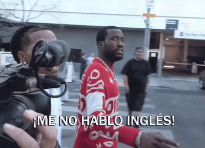 A Man Wearing A Red Sweater Is Being Filmed By A Camera And Says Me No Hablo Ingles GIF