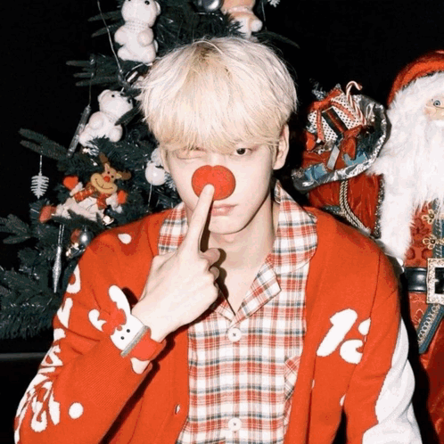 A Man Wearing A Red Sweater With A Reindeer On It GIF