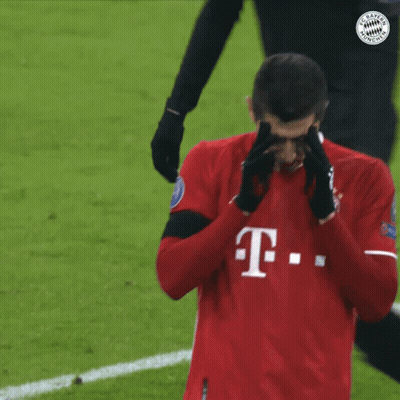 A Man Wearing A Red T-Mobile Jersey Covering His Nose GIF