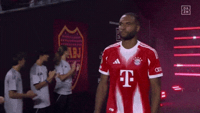 A Man Wearing A Red T-Mobile Jersey Stands In Front Of A Sign That Says Abj GIF