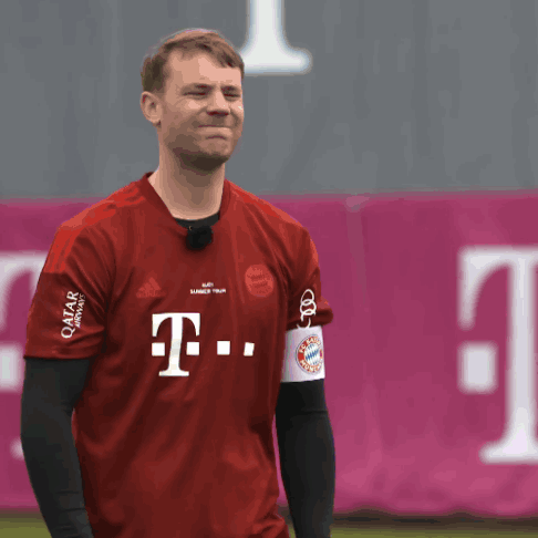 A Man Wearing A Red T-Mobile Shirt Makes A Face GIF