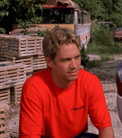A Man Wearing A Red T-Shirt With The Word Greddy On It GIF