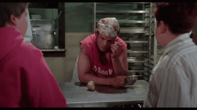 A Man Wearing A Red Tank Top That Says ' I 'M Robert ' On It GIF