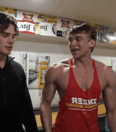 A Man Wearing A Red Tank Top That Says Яззи On It GIF