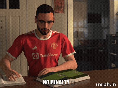 A Man Wearing A Red Teamviewer Jersey Sits At A Table GIF