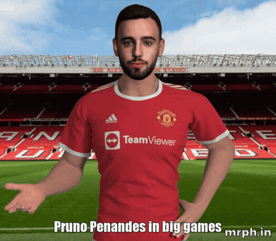 A Man Wearing A Red Teamviewer Jersey Stands In Front Of A Soccer Field GIF