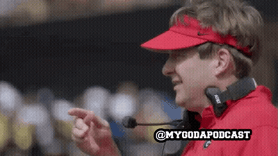 A Man Wearing A Red Visor And Headphones With The Words @Mygodapodcast Written Below Him GIF