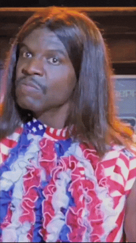 A Man Wearing A Red White And Blue Shirt And A Lei Around His Neck GIF