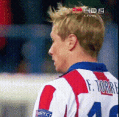 A Man Wearing A Red White And Blue Striped Shirt With The Number 40 On The Back GIF