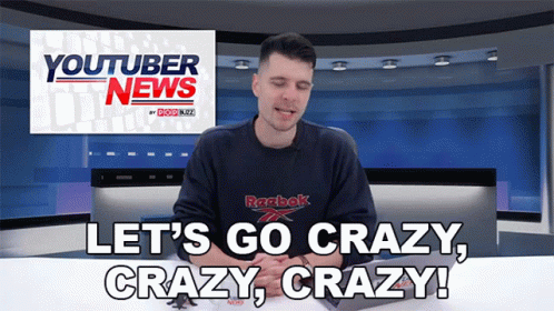 A Man Wearing A Reebok Shirt Is Sitting In Front Of A Youtuber News Sign GIF