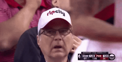 A Man Wearing A Rip City Hat And Glasses Is Watching A Basketball Game GIF