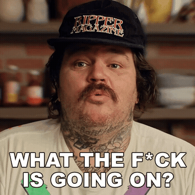 A Man Wearing A Ripper Magazine Hat Is Asking What The Fuck Is Going On GIF