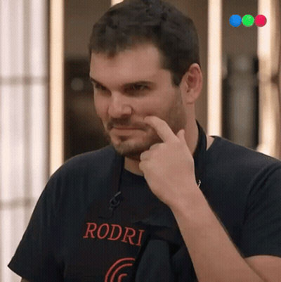 A Man Wearing A Rodri T-Shirt Is Pointing At His Face GIF