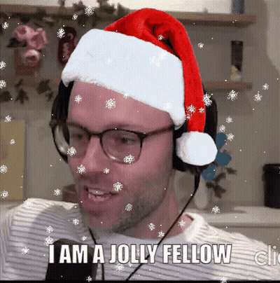A Man Wearing A Santa Hat And Headphones Says " I Am A Jolly Fellow " GIF
