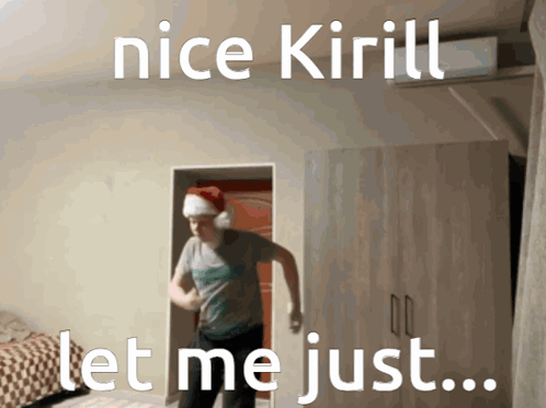 A Man Wearing A Santa Hat Is Dancing In A Room With The Words Nice Kirill Let Me Just GIF