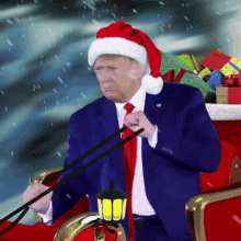 A Man Wearing A Santa Hat Is Riding In A Sleigh GIF