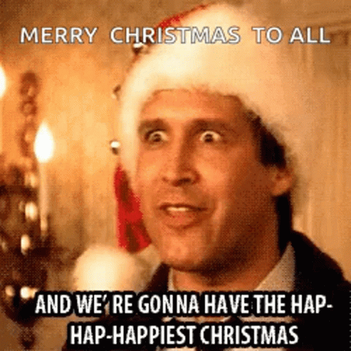 A Man Wearing A Santa Hat Is Saying Merry Christmas To All . GIF