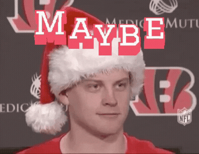A Man Wearing A Santa Hat With The Word Maybe Written On It GIF