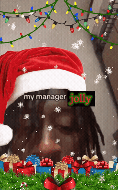 A Man Wearing A Santa Hat With The Words " My Manager Jolly " GIF