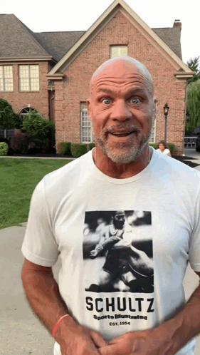 A Man Wearing A Schultz Sports Illustrated T-Shirt GIF
