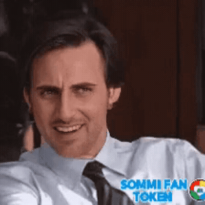 A Man Wearing A Shirt And Tie With Sommi Fan Token On His Shirt GIF