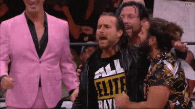 A Man Wearing A Shirt That Says All Elite Rays Is Surrounded By Other Men GIF