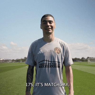 A Man Wearing A Shirt That Says American Family Insurance On It GIF