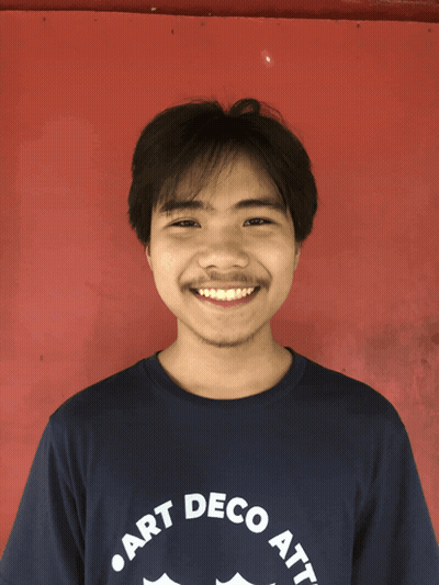 A Man Wearing A Shirt That Says " Art Deco Att " Smiles For The Camera GIF