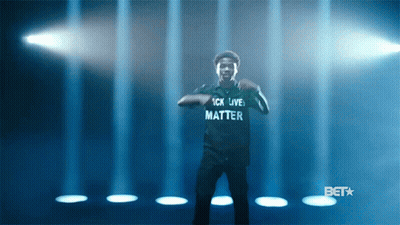 A Man Wearing A Shirt That Says " Black Lives Matter " GIF
