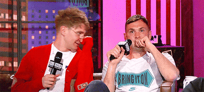 A Man Wearing A Shirt That Says Bring It On GIF