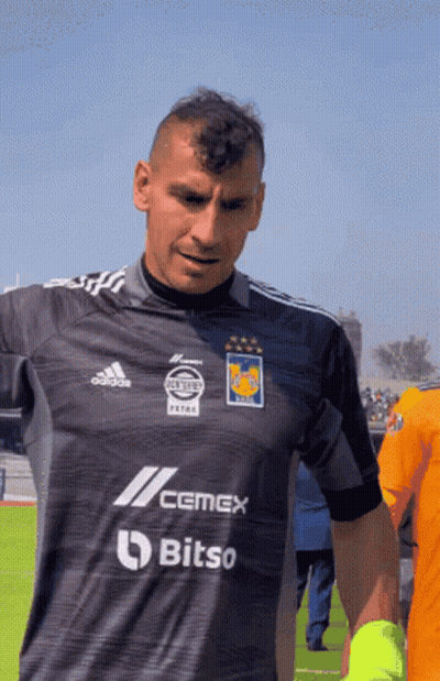 A Man Wearing A Shirt That Says Cemex Bitso On It GIF
