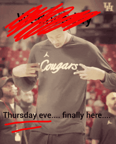 A Man Wearing A Shirt That Says Cougars Is Standing In Front Of A Crowd GIF