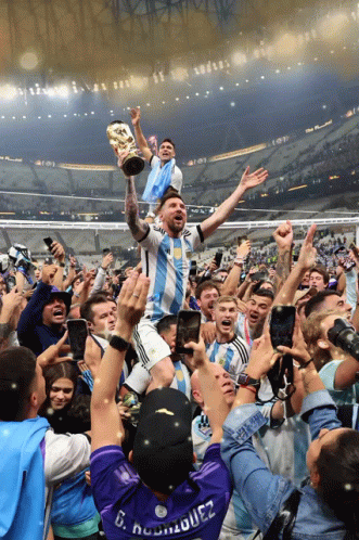 A Man Wearing A Shirt That Says D. Rodriguez Holds A Trophy GIF
