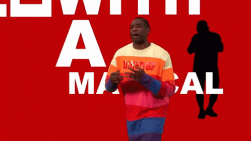A Man Wearing A Shirt That Says Dikembe On It GIF