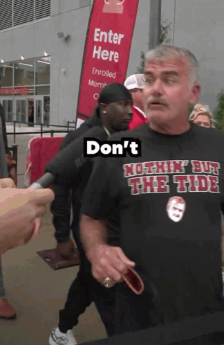 A Man Wearing A Shirt That Says Do N't GIF